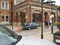KingRichardIIIandFootball070  You are just out of town for a few hours and you come back and find this in front of the station.  You can see four pillars. And according to marks on the walls, this car went between the far right pillar and that pole next to it. Amazing.