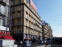 Napels 2017 118  Our hotel is next to the blue neon lights. Our room, by pure coincidence, is where the Dutch Flag hangs out. We will not mention that the first flag around the corner was a German flag, which was also hanging from "our" room.